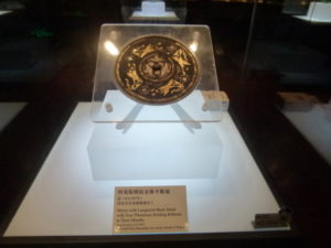 mirror with lacquered back inlaid with four phoenixes holding ribbons in their mouths